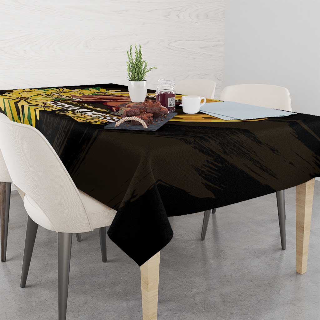Black tablecloth with yellow horse, daisies, and text design on tabletop