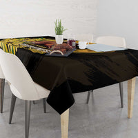 Black tablecloth with yellow horse, daisies, and text design on tabletop