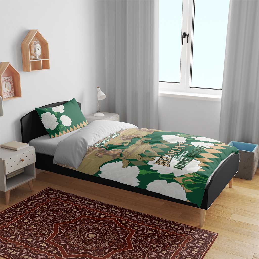 Green horse racing bedding set on a bed with patterned duvet and white flower accents