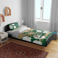 Green horse racing bedding set on a bed with patterned duvet and white flower accents