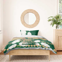 Green horse racing bedding set on a bed with white flower design and “Belmont” on duvet