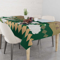 Green horse racing tablecloth with corner drape, white blossoms and Belmont Stakes print