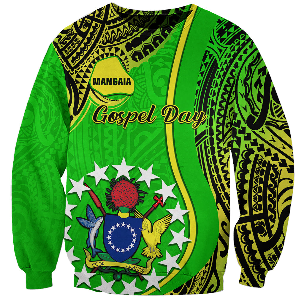 Green crewneck sweatshirt with Polynesian crest, stars, and 'Mangaia Gospel Day' graphic.