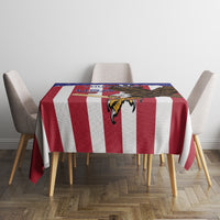 Red, white and navy cricket tablecloth on dining table with matching patterned print