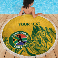 Yellow round beach blanket with white fringed edge, South Africa Cricket/Proteas and palm leaves