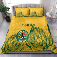 Yellow duvet and matching pillows with green tropical print, Proteas crest, and “YOUR TEXT”