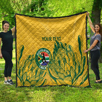 Yellow quilt with diamond quilting and green tropical palm pattern, “YOUR TEXT” front center.