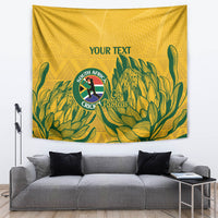Yellow wall tapestry with green plant pattern, South Africa cricket crest and 'YOUR TEXT'.