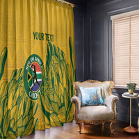Yellow cricket window curtains with green leaf graphic, crest, and hanging rod rings
