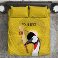 Yellow bedding set with crowned crane graphic and two matching pillowcases