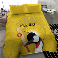 Yellow duvet cover with crowned crane illustration and two matching pillowcases