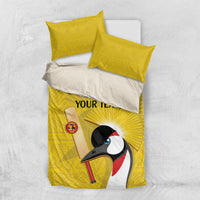 Yellow bedding set with crowned crane design on duvet and two matching pillowcases