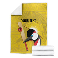 Yellow cricket blanket folded, crowned crane print with 'YOUR TEXT', with white rolls
