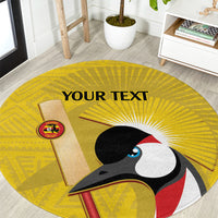 Round yellow cricket-themed carpet with crowned crane graphic and logo patch