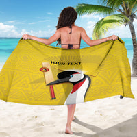 Yellow sarong with crowned crane graphic and 'YOUR TEXT' text, draped back view