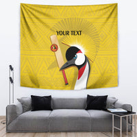 Yellow tapestry with crowned crane illustration and 'YOUR TEXT' over geometric pattern
