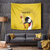 Yellow wall tapestry featuring crowned crane, sun rays, and 'YOUR TEXT' lettering