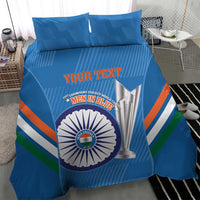 Blue bedding set showing custom text, cricket logo circle, trophy graphic, and tri-color stripes