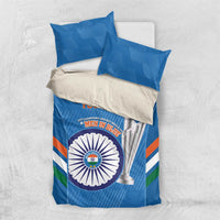Blue duvet cover and matching pillows with cricket emblem, trophy graphic, and striped banding