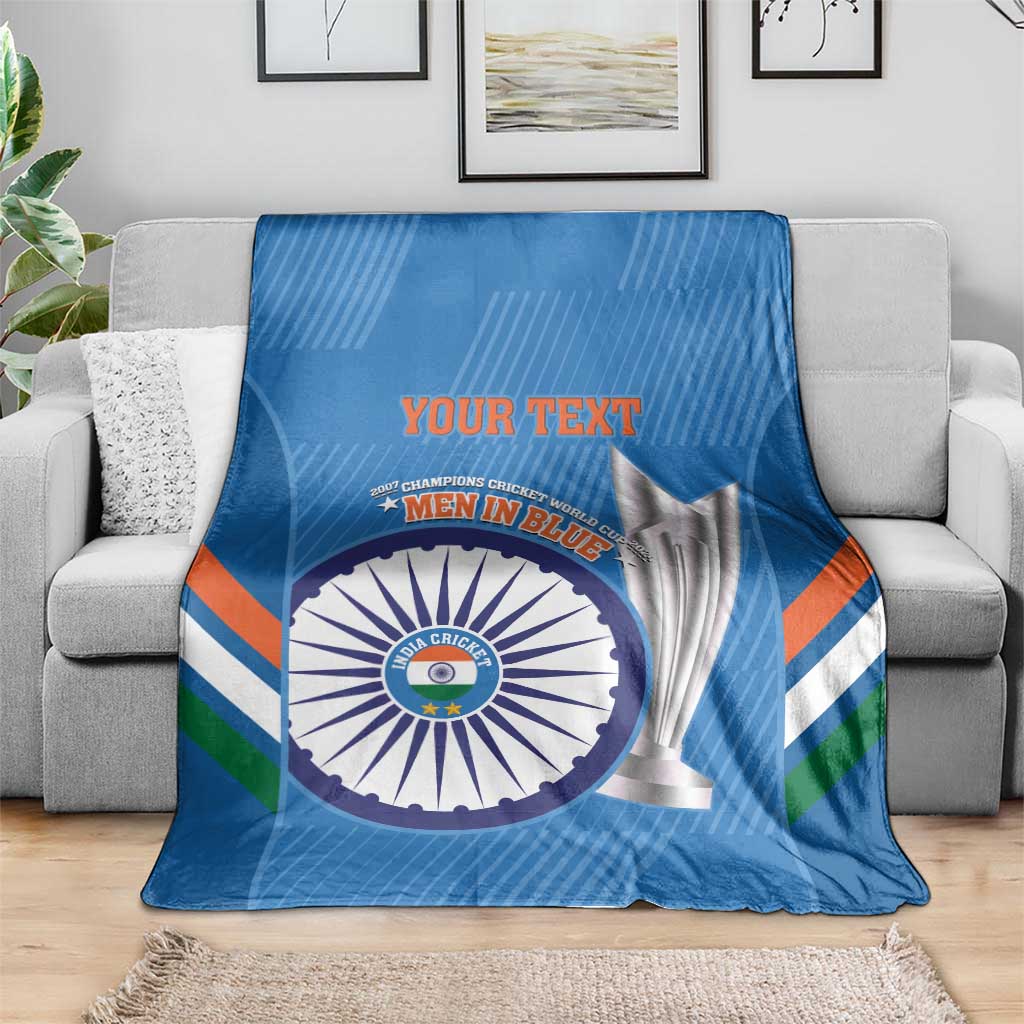 Blue cricket blanket over gray sofa with Men in Blue emblem and YOUR TEXT