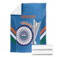 Folded blue cricket blanket with Men in Blue emblem and YOUR TEXT, with white towels