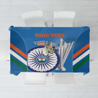 Blue tablecloth panel featuring circular cricket trophy emblem and bold text area at center