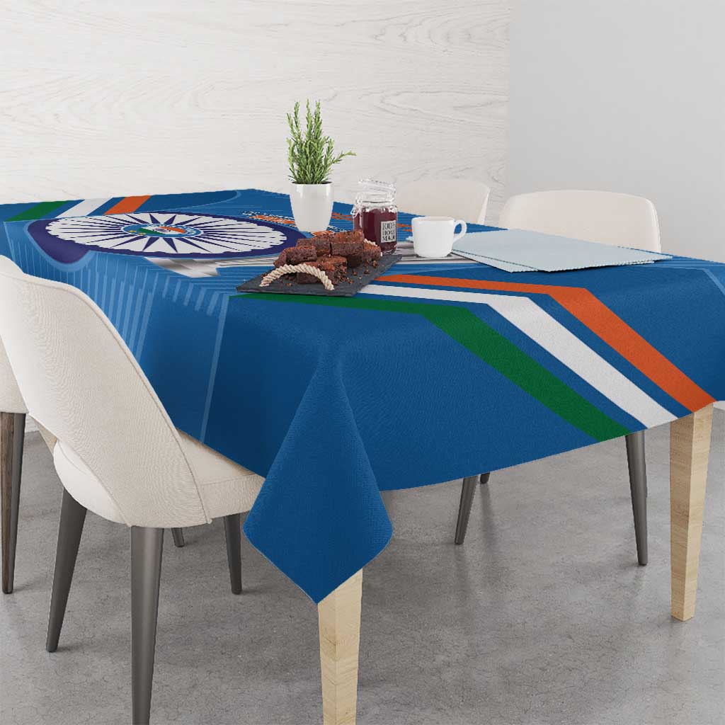 Blue tablecloth with cricket emblem, multi-color stripes, and straight edge drape on table