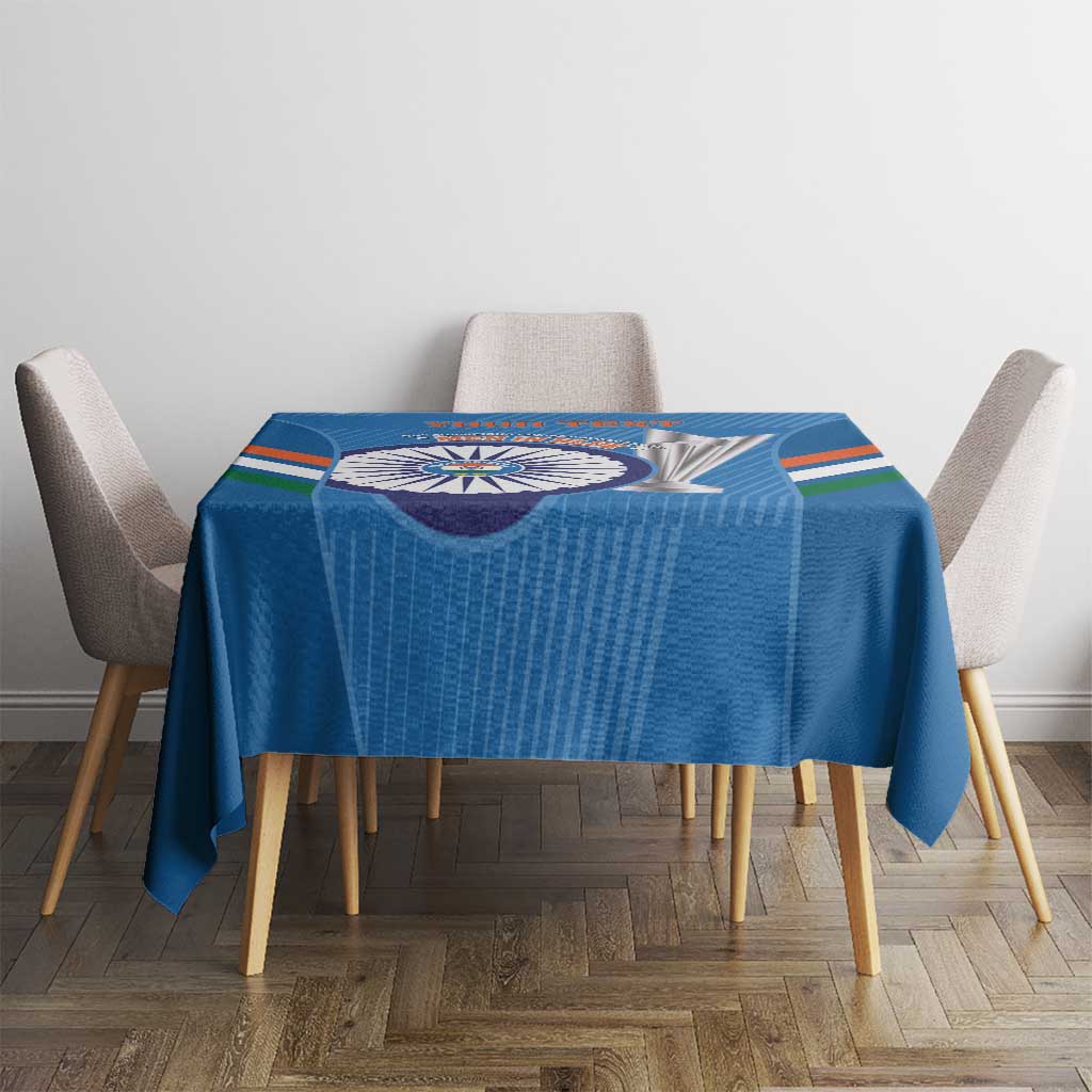 Blue tablecloth with centered cricket emblem and multi-color bands, on dining table