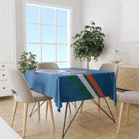 Blue cricket-themed tablecloth with striped design and emblem, on table in bright room