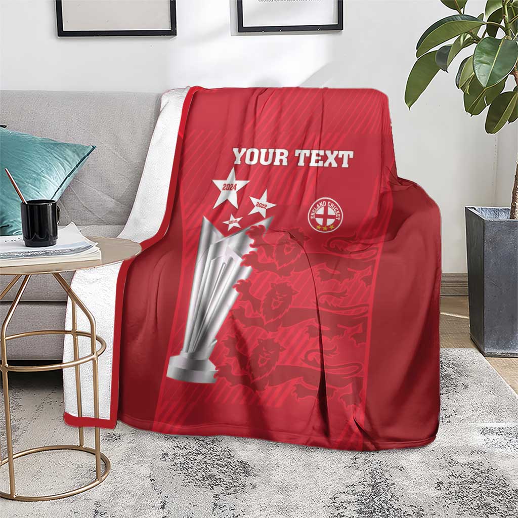 Red cricket blanket on sofa with 'YOUR TEXT' trophy and badge emblem