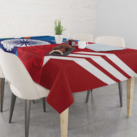Blue and red cricket-themed tablecloth draped over a dining table with tableware