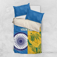 Cricket bedding set laid flat: blue duvet with circular emblem, yellow-green section, two pillowcases