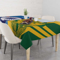 Cricket tablecloth on table with green leaf pattern and bold blue and yellow stripes