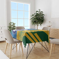 Cricket tablecloth covering a dining table in blue, yellow, and green diagonal stripes