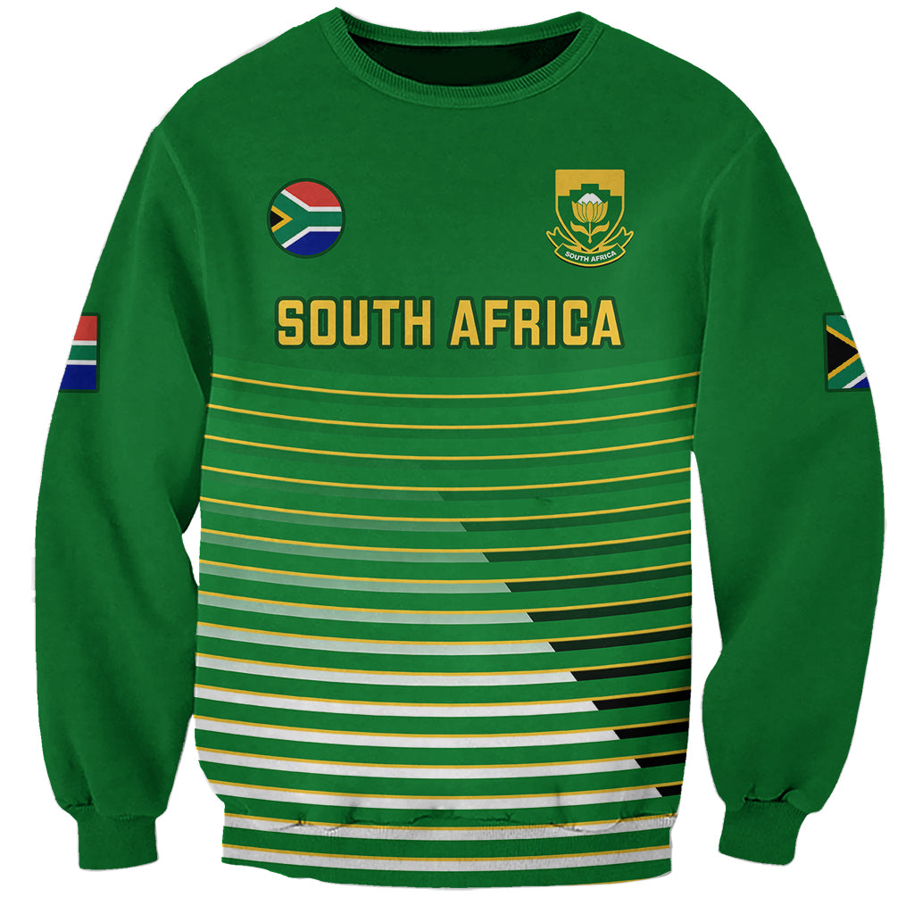 Green soccer sweatshirt with South Africa graphic, flag patch sleeves, and striped chest