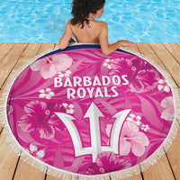 Round pink Barbados Royals beach blanket, white “17” logo with hibiscus-style flowers