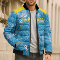 Blue tropical puffer bomber jacket with yellow yoke, front zip, black ribbed cuffs and hem