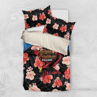 Cricket bedding set flat lay: black floral duvet, blue accents, Falcons emblem, matching pillows
