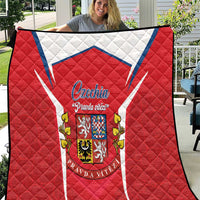 Red quilt with white-blue chevron and Czechia crest emblem, quilted diamond pattern