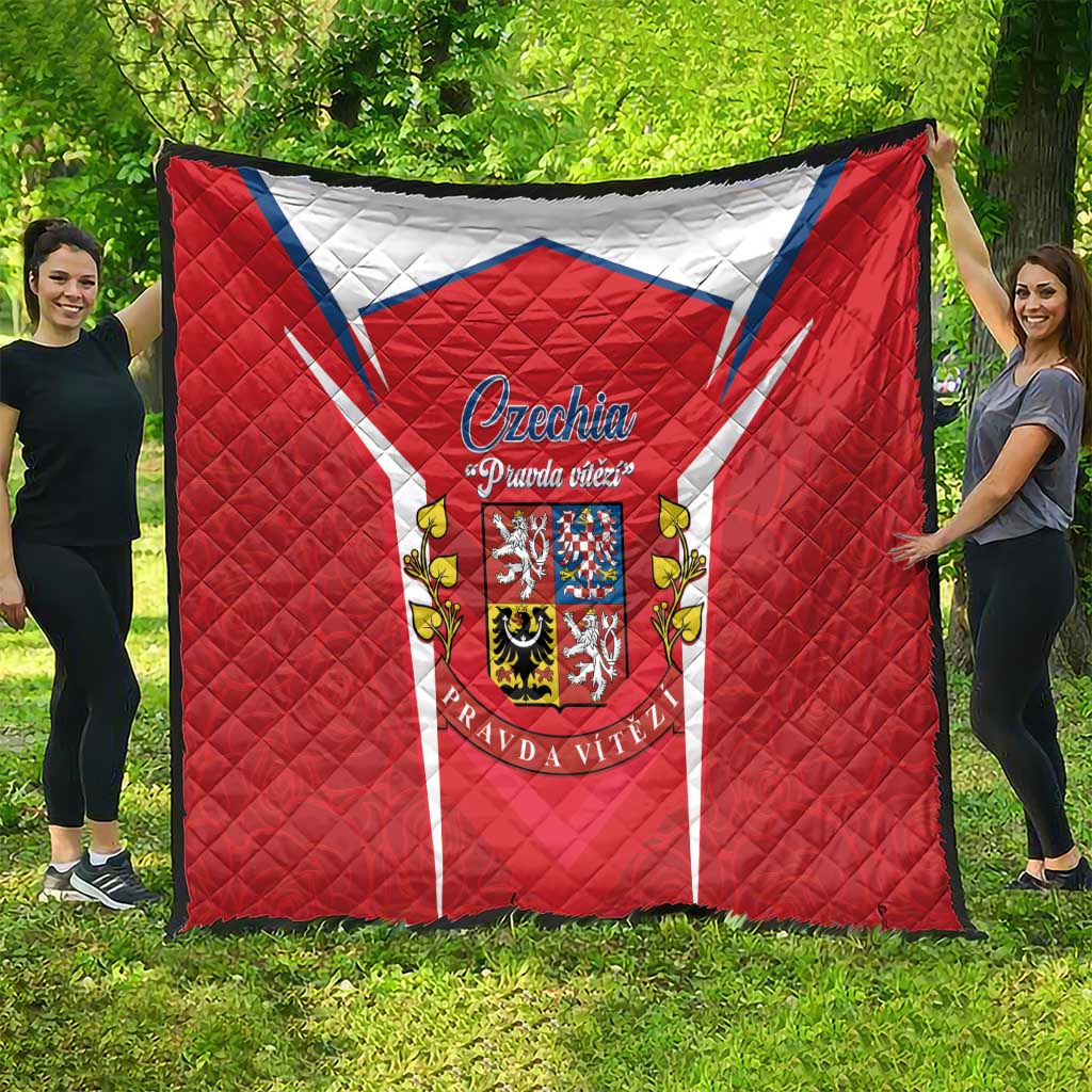 Large red Czechia flag quilt with crest medallion, white stripes, and quilted texture
