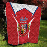 Red quilt with Czechia crest center and white-blue chevron border, quilted diamond stitching