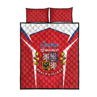 Red quilt bed set with white diagonal stripe, Czech crest emblem, and 2 matching red pillows