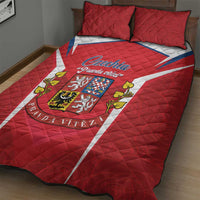 Red quilt bed set with white diagonal stripe and Czech crest emblem, shown with two red pillows