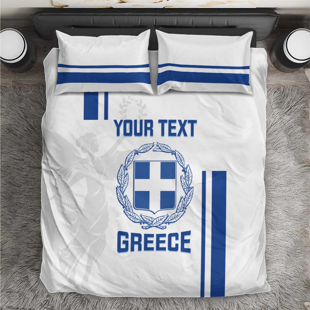 White bedding set with Greece crest, blue flag stripes, and custom text on comforter and pillows.