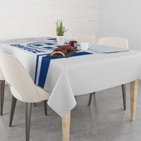 White tablecloth with blue Greece crest stripe runner across the table