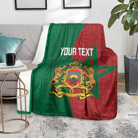 Personalized Moroccan blanket folded on chair: green and red geometric pattern