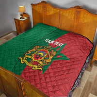 Personalised Morocco quilt on bed: green/red star panels, quilted stitching and Moorish crest