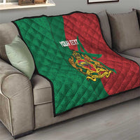 Personalised Morocco quilt on sofa: green and red star panels with quilted pattern and crest