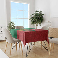 Morocco tablecloth draped over dining table, green and red star geometric pattern