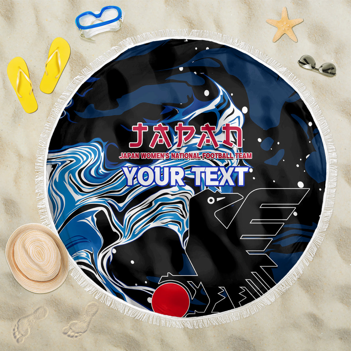 Round black beach blanket with blue wave graphic, fringe border, red emblem print
